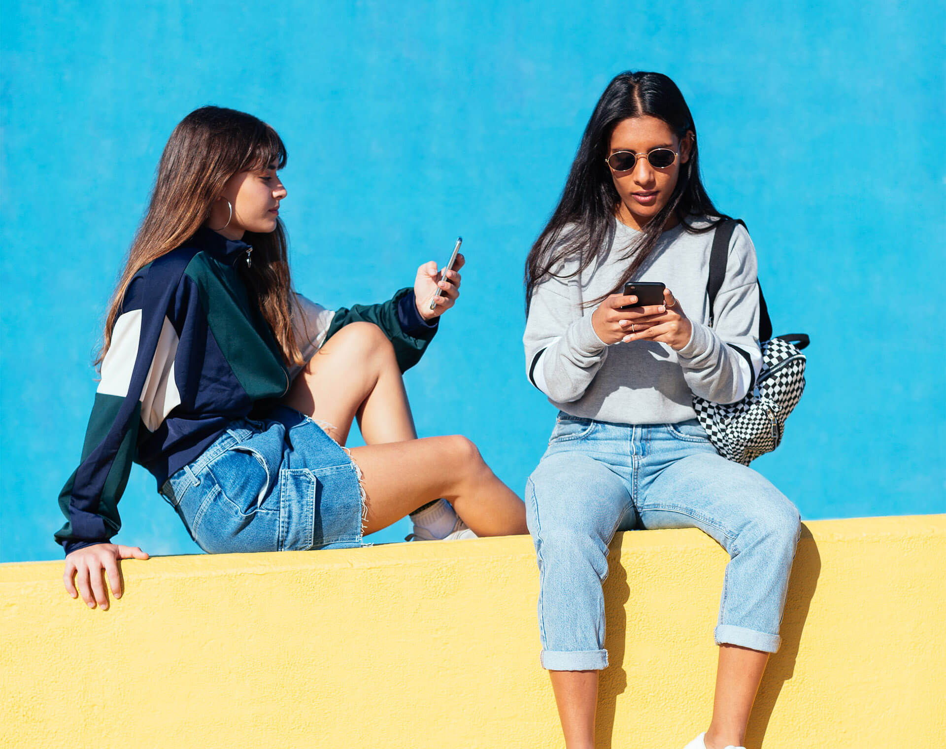 Girls shopping online on phones